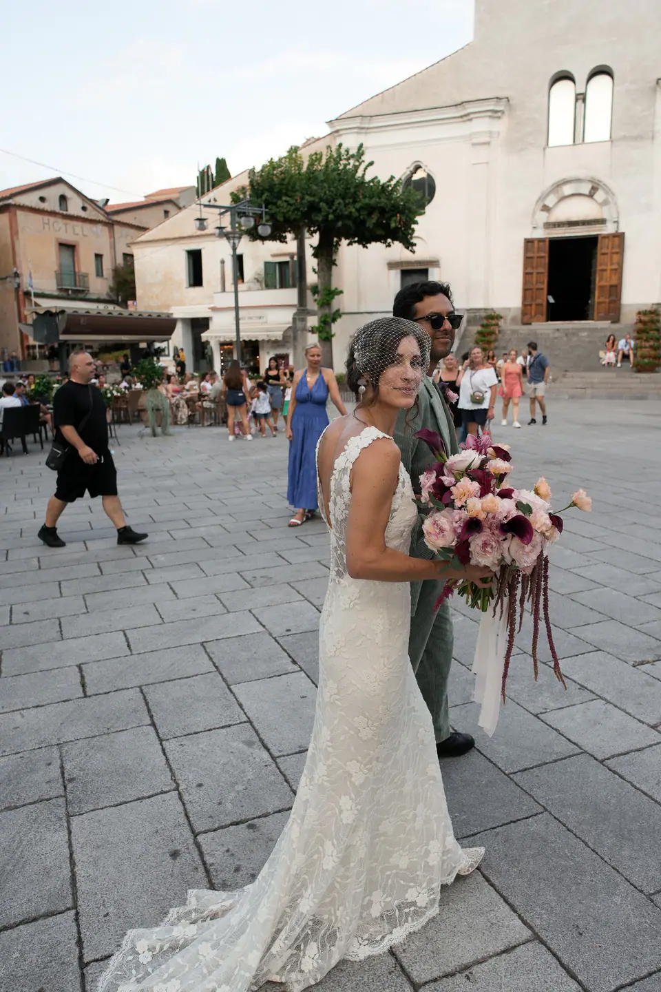 Bride in the main square of Ravello, the cathedral behind her.