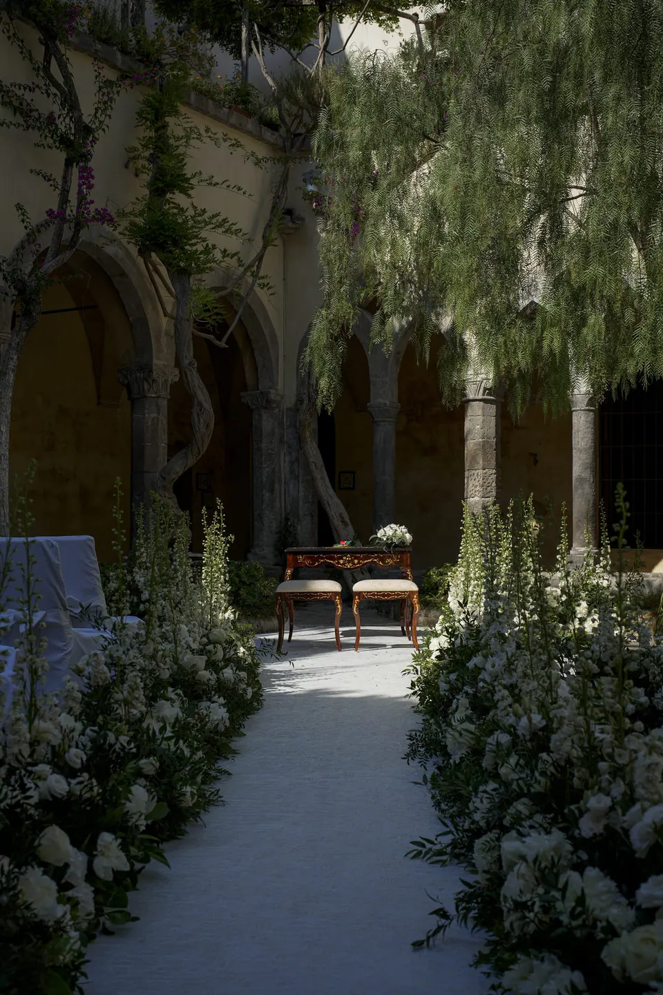 The flower-lined aisle in the cloister of San Francesco before the ceremony