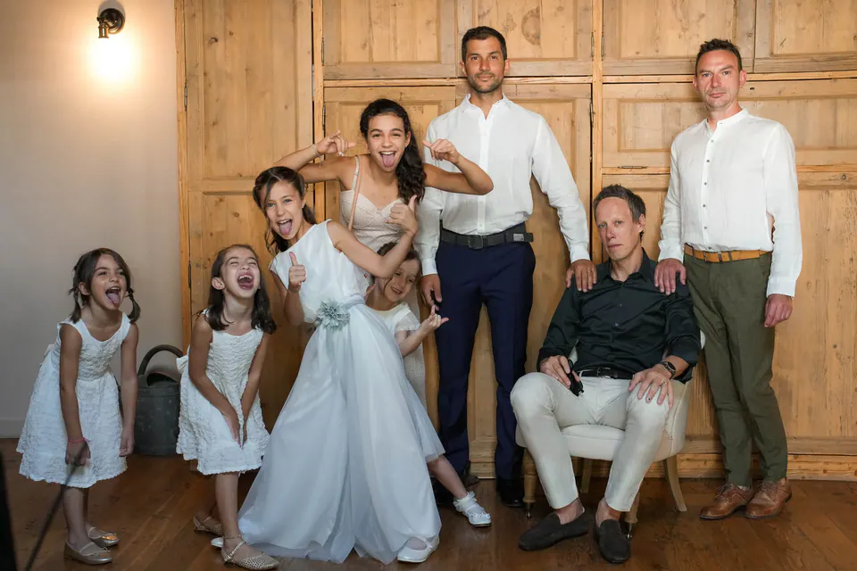 The couple with their daughters in natural light.