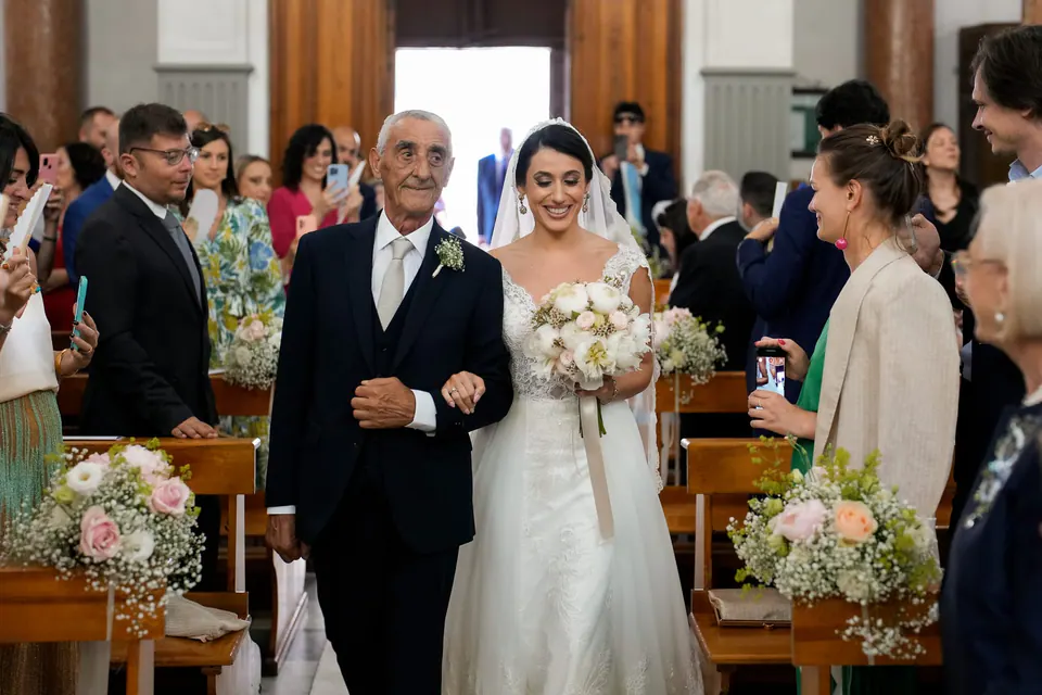Bride walking down the aisle with her father