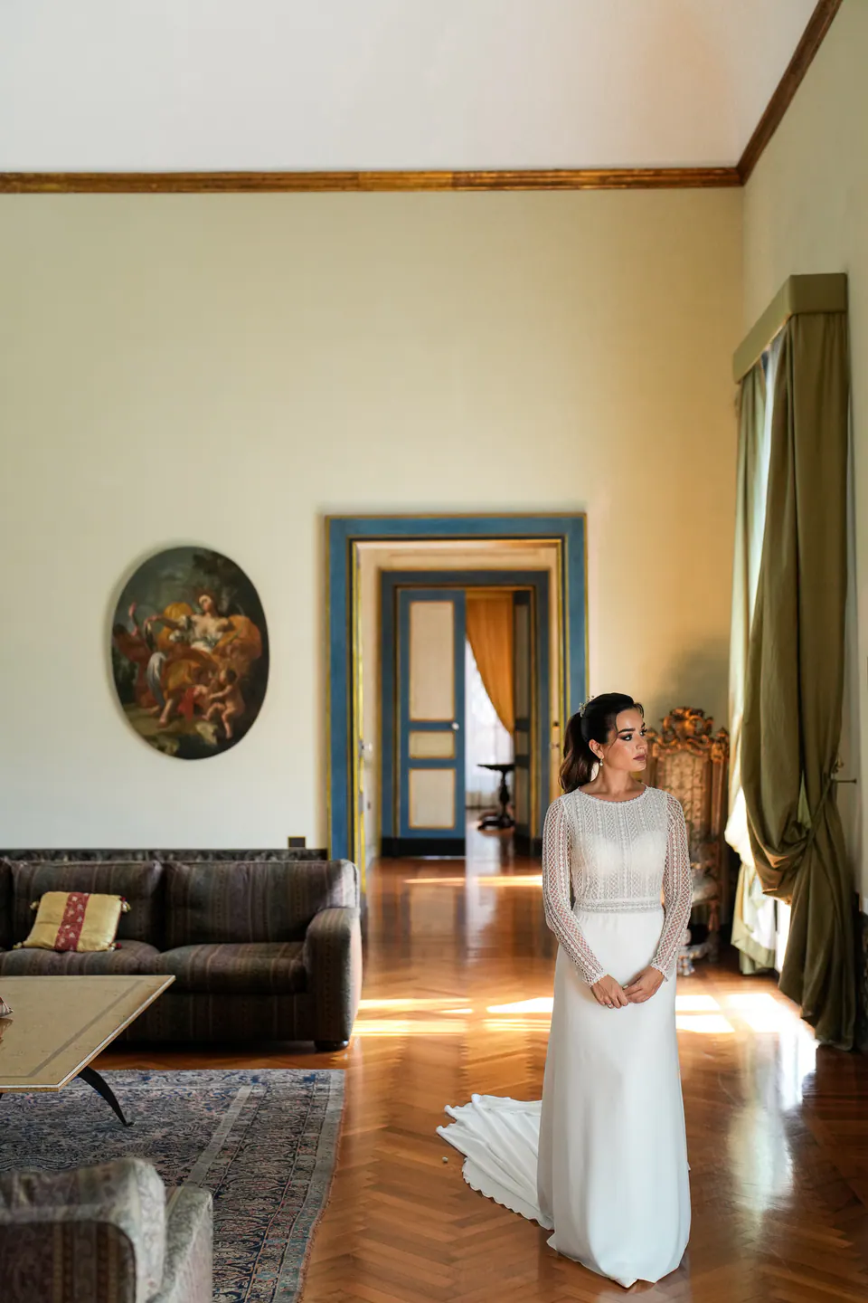 Bride sitting in a Neapolitan apartment on the morning of the wedding.