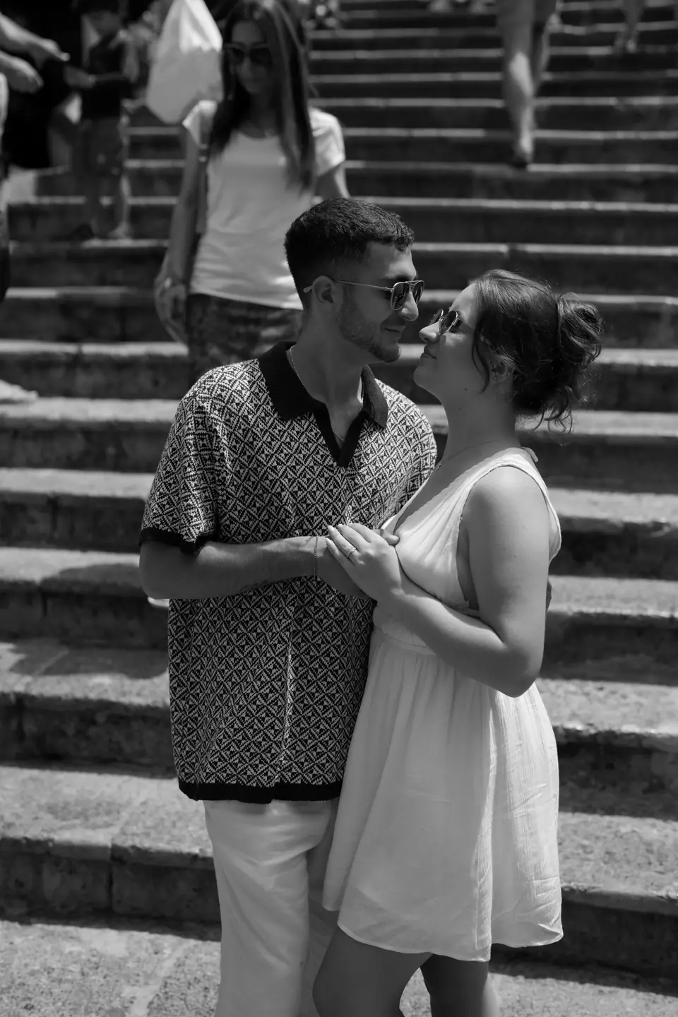 Black and white photo of the couple on the steps of Positano.