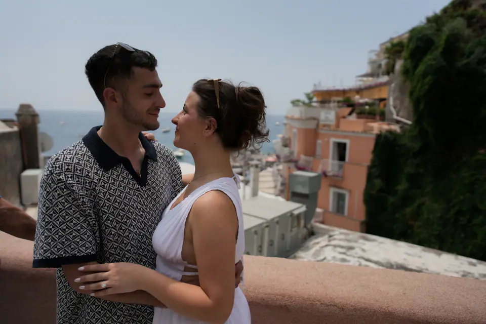 Couple face to face on a terrace in Positano.
