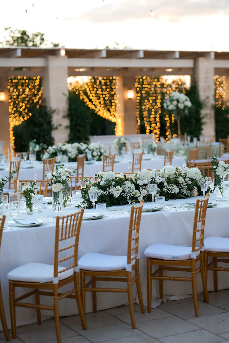 Dinner table at Tenuta San Domenico with gold cutlery, crystal glasses and blush flowers.