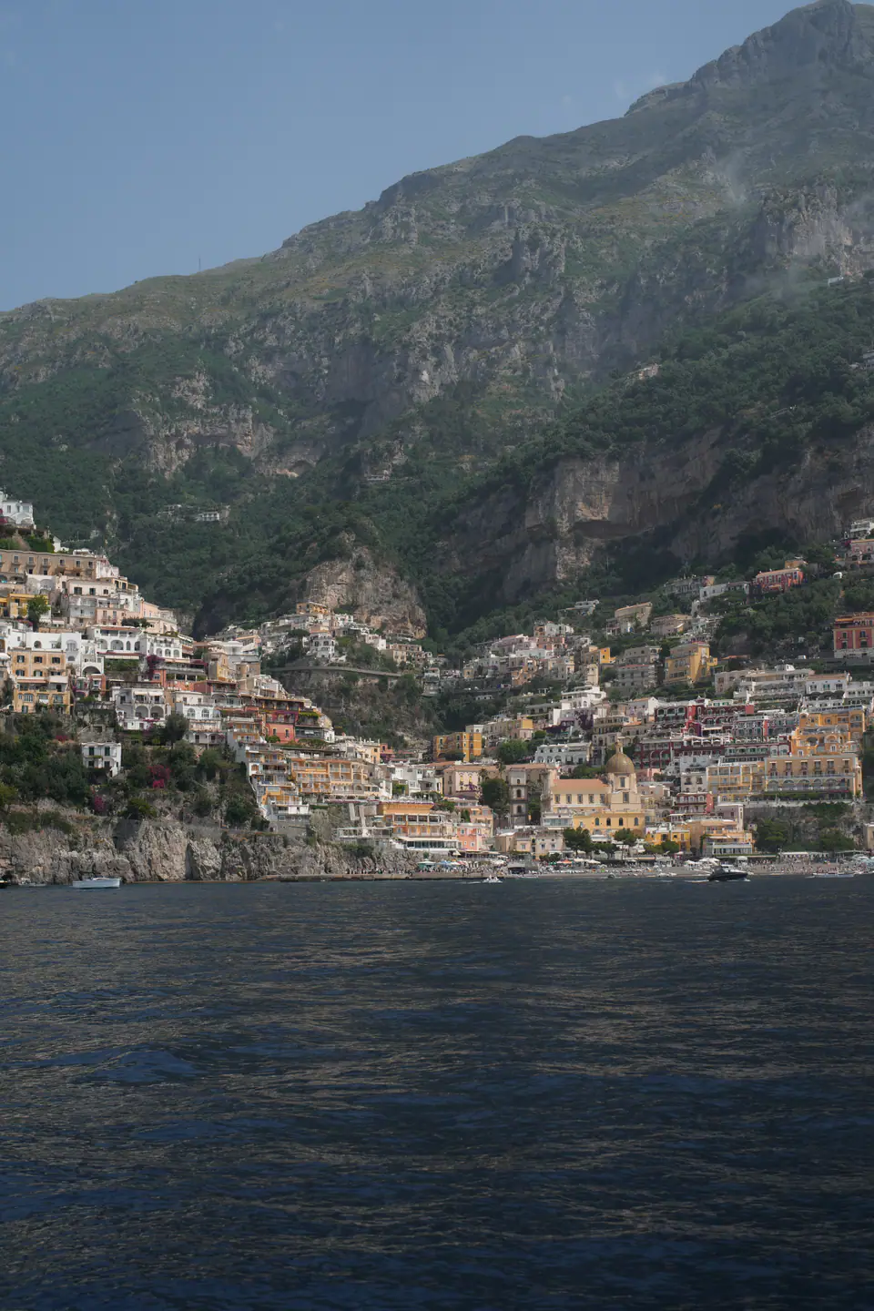 Positano seen from the sea, the town climbing the mountain.