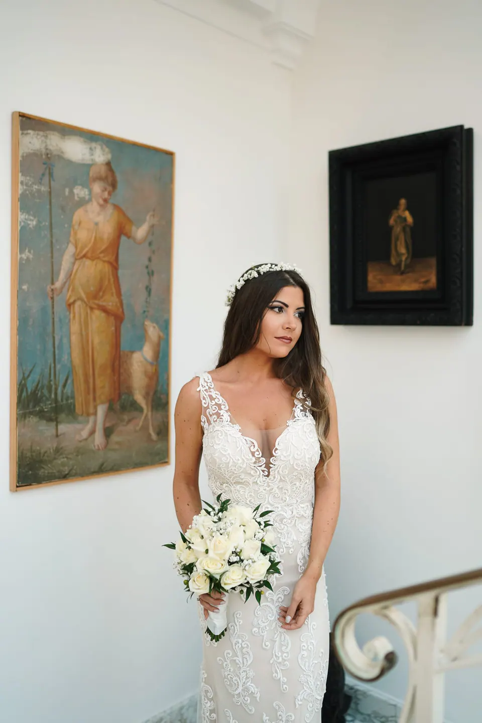 Bride posing indoors with natural light, classic editorial bridal portrait for wedding portfolio.