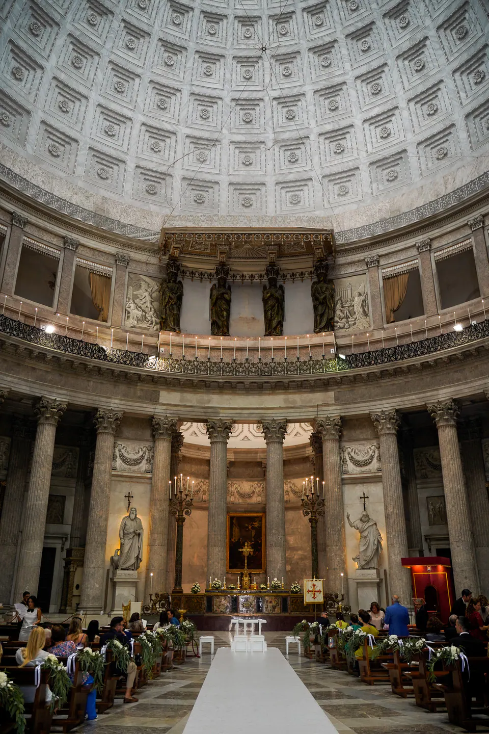 Interior of the Basilica of San Francesco di Paola in Naples during the wedding ceremony, the coffered dome above.