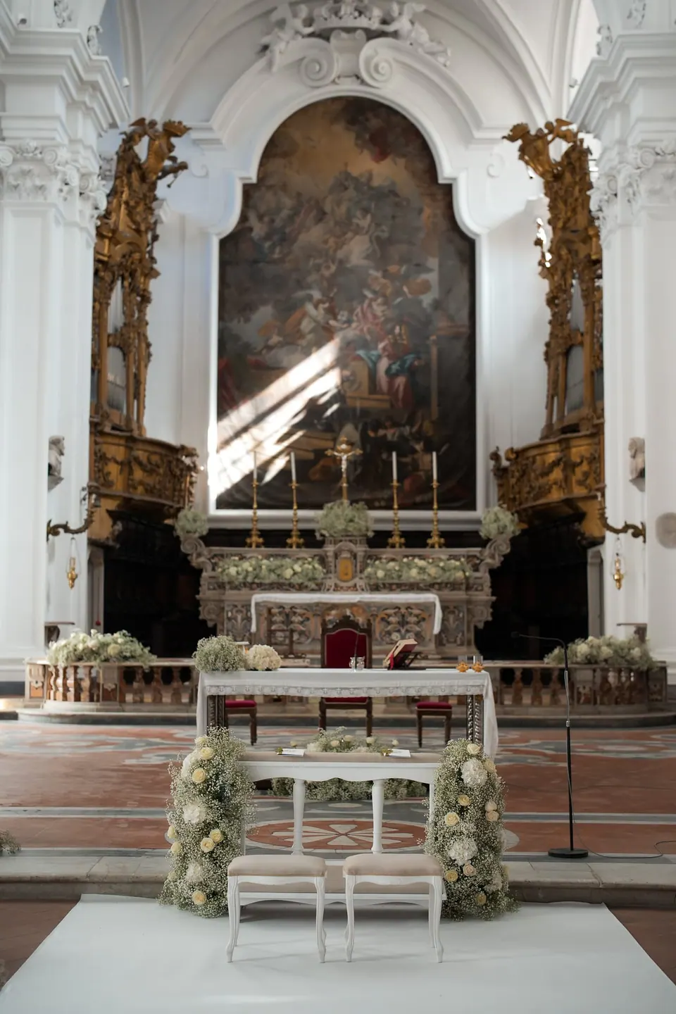 Church altar decorated with white flowers before the ceremony