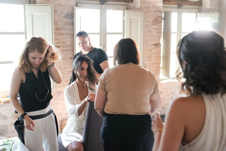 Make-up artist doing the bride's final touches.