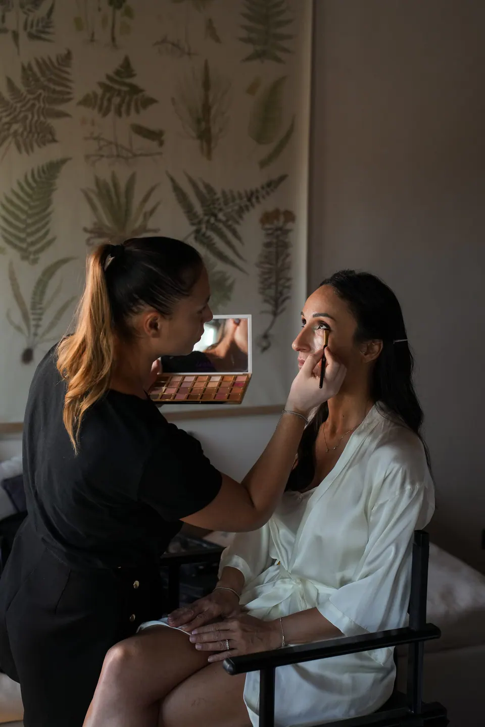 Make-up artist working on the bride