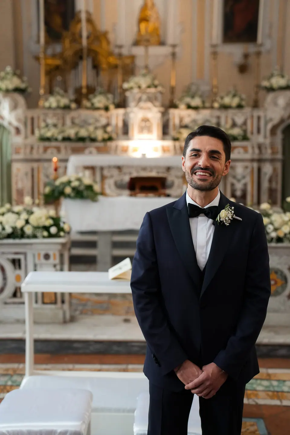 Groom waiting for the bride at the altar.