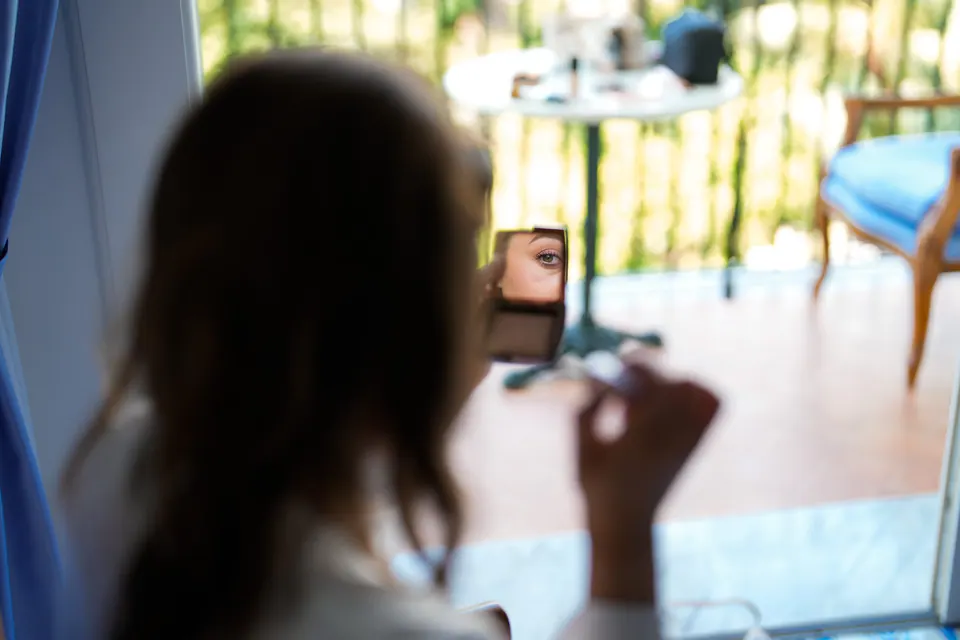 A guest taking a photo of the ceremony with a phone.