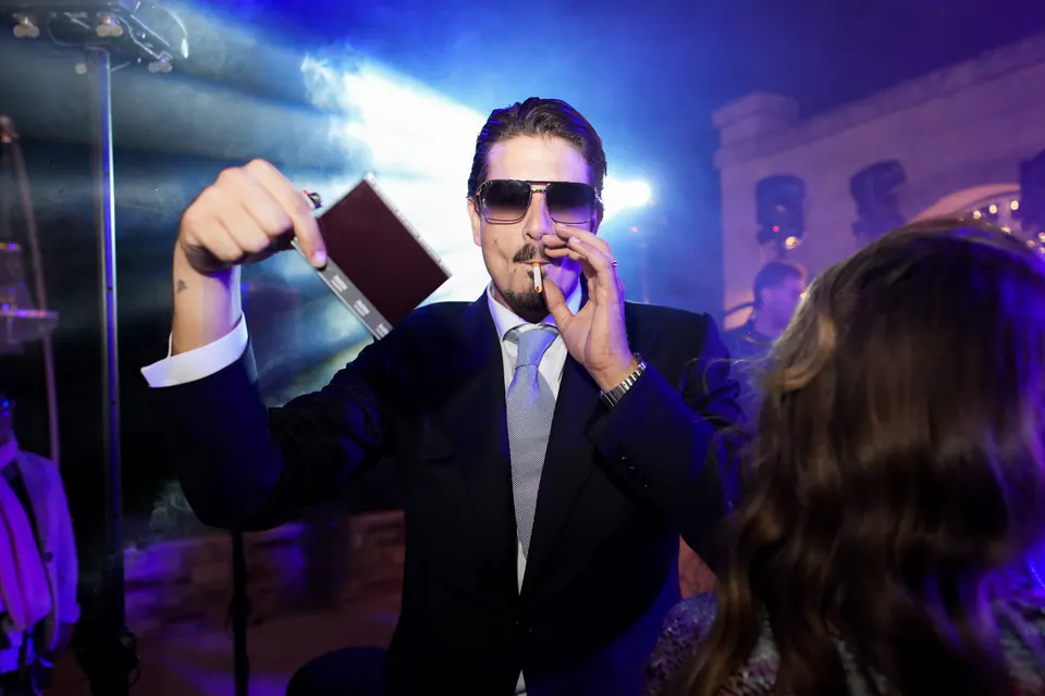 A guest in sunglasses on the dance floor