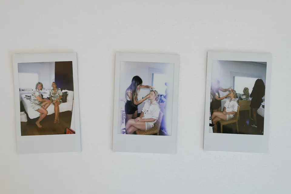 Photos of Aaron and April pinned on a wall at Relais Blu.