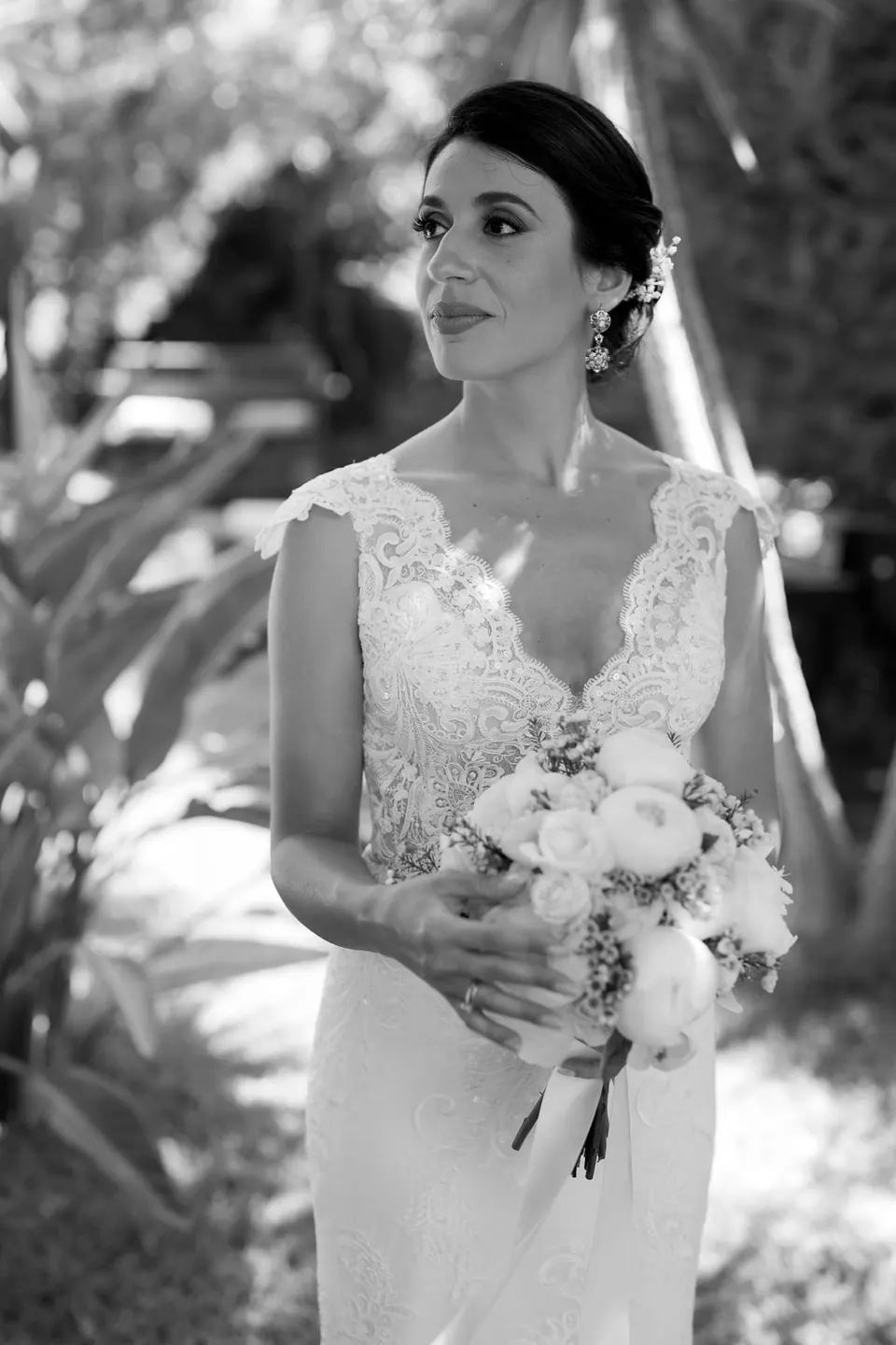 Black and white portrait of the bride holding her bouquet