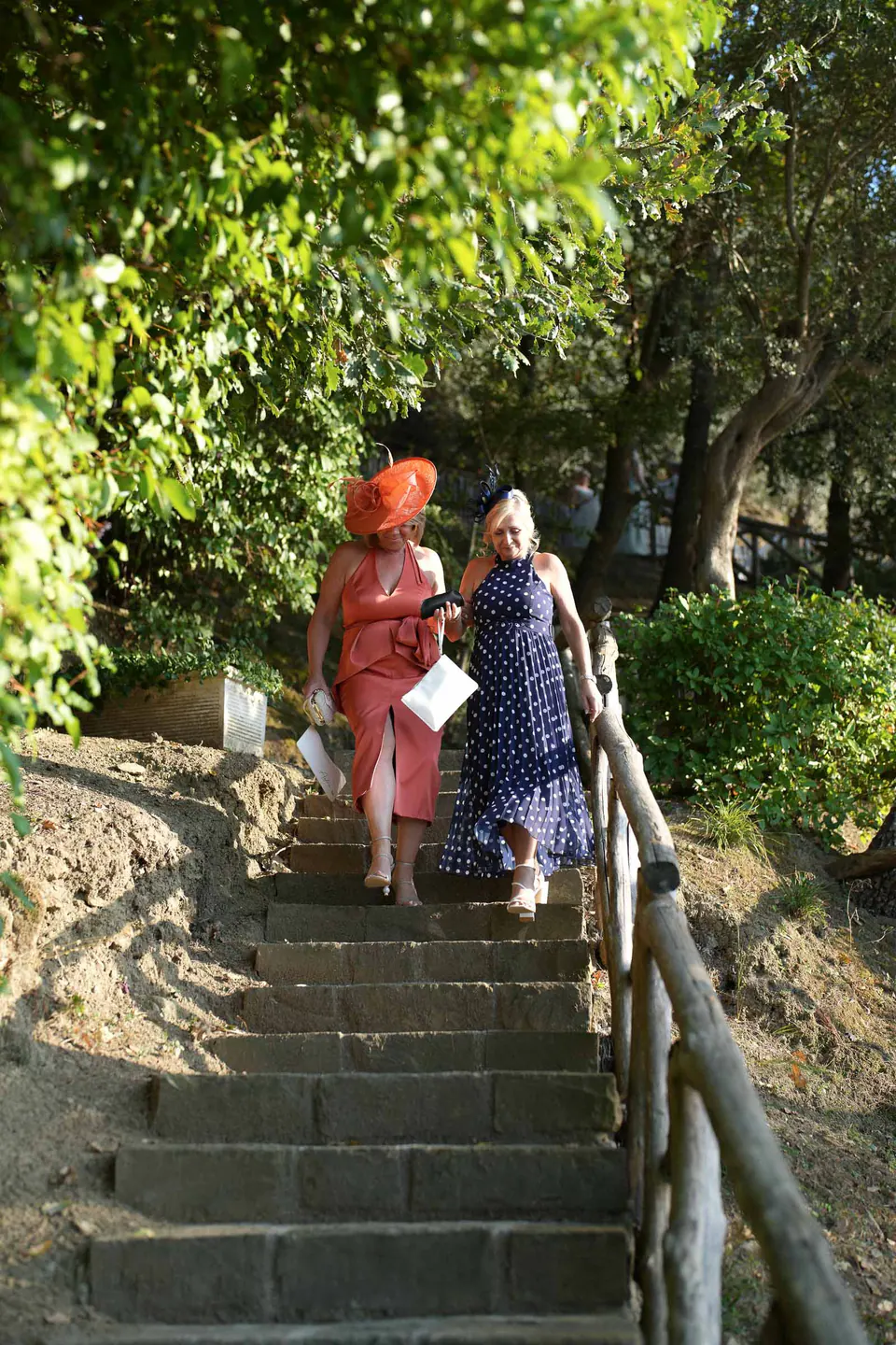 Guests walking up the stone steps in the garden