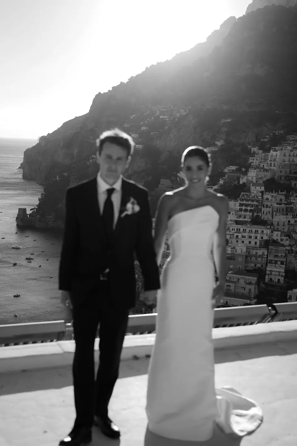 Black and white photo of the couple facing each other on the terrace.