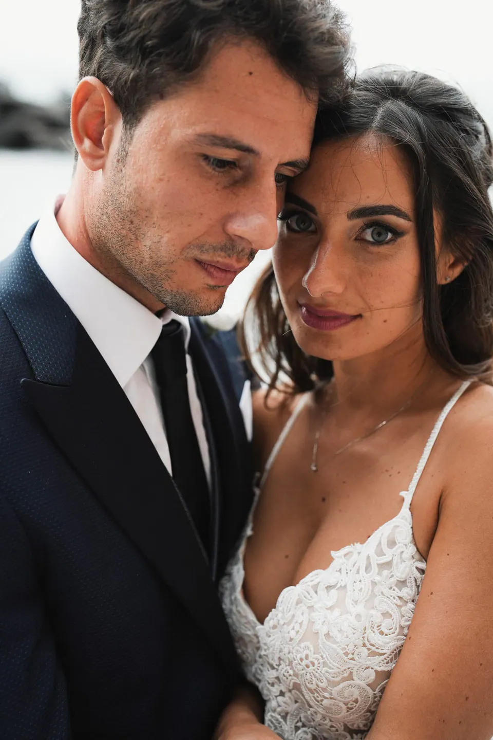 Close portrait of the bride and groom on their wedding day at Castello Giusso.