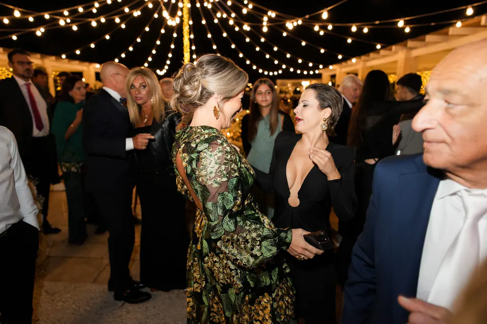 Guests clapping and laughing during the evening party.
